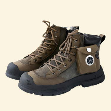 Brown and black USB heated hiking boots with power button pouch on soft beige background